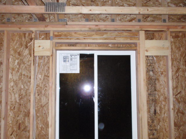 The two retangular pieces of wood on the outside of the window framing are examples of window covering supports that Tony added.
